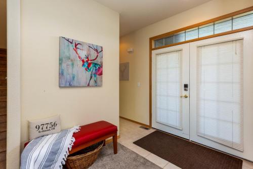 a room with a red bench next to a door at Spacious 4BR Private HOT TUB Eagle Crest Resort on Golf Course in Redmond