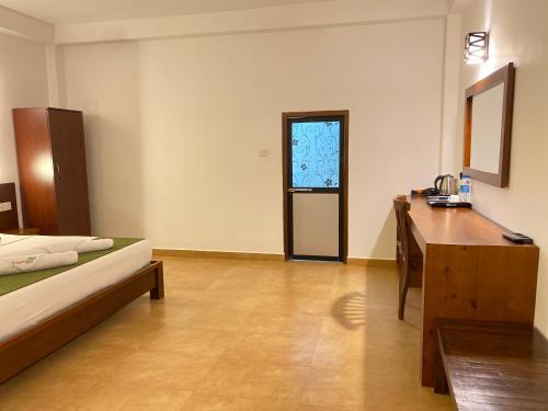 Postel nebo postele na pokoji v ubytování Tropicara Resort