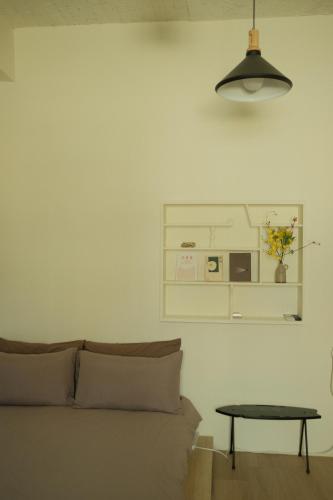 a living room with a couch and a table at Maru in Tainan