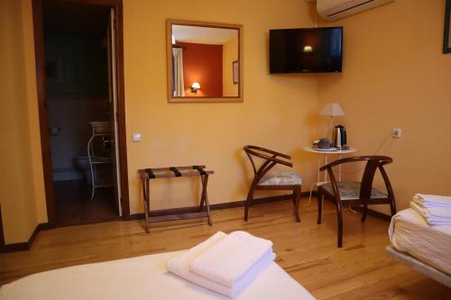 Ένα ή περισσότερα κρεβάτια σε δωμάτιο στο Hotel Rural El Almadiero