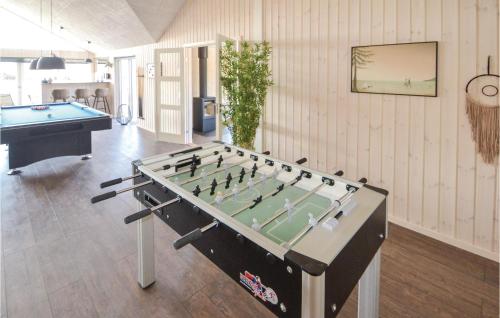 a billiard table in a room with a pool table at Lovely Home In Grenaa With Sauna in Grenå