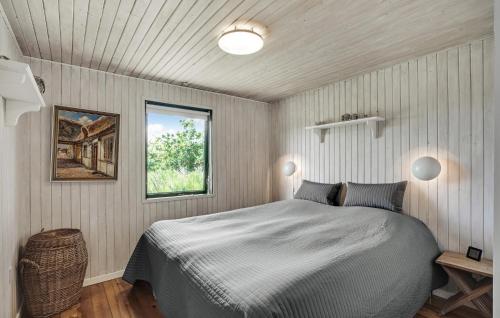 a bedroom with a bed and a window at Beautiful Home In Spøttrup With Kitchen in Spottrup