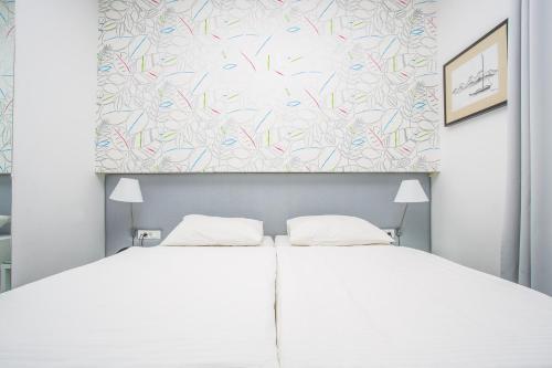 Hotel Jonaにあるベッド