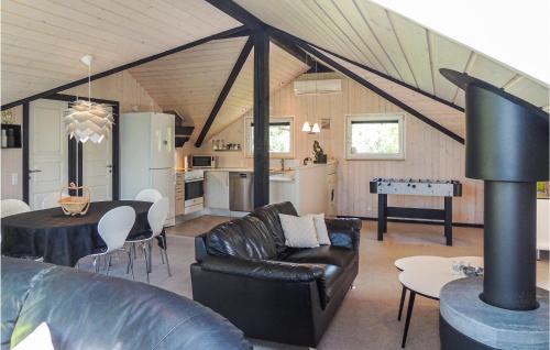 a living room with a couch and a table in a room at Gorgeous Home In Hemmet With Wifi in Hemmet