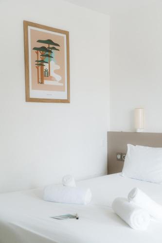 Ένα ή περισσότερα κρεβάτια σε δωμάτιο στο Hôtel Les Fougères - Hossegor
