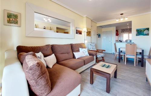 a living room with a couch and a table at Cozy Apartment In Cabanes With Wifi in Cabanes