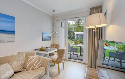 a living room with a couch and a table at Baltischer Hof Apartment 20 in Boltenhagen