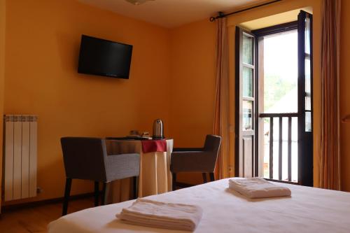 Ένα ή περισσότερα κρεβάτια σε δωμάτιο στο Hotel Rural El Almadiero