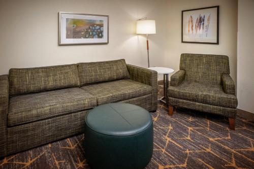 a living room with a couch and a chair at Holiday Inn Hotel & Suites Beckley by IHG in Beckley