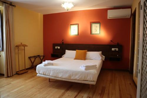 Ένα ή περισσότερα κρεβάτια σε δωμάτιο στο Hotel Rural El Almadiero
