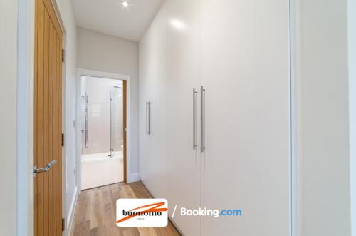 a bathroom with a shower and a glass door at Two Bedroom Apartment At Buonomo Stays Short Lets & Serviced Accommodation close to Wimbledon Tennis Courts in London