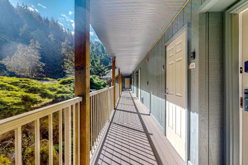 a porch of a house with a view of a mountain at Rosario Road Condo - B in Eastsound