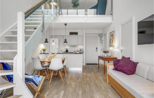 a living room and kitchen with a table and a couch at Apartment Marienlyst 06 in Helsingør