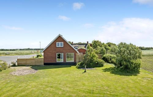 a house on the side of a road at Nice Home In Thyholm With Wifi in Thyholm