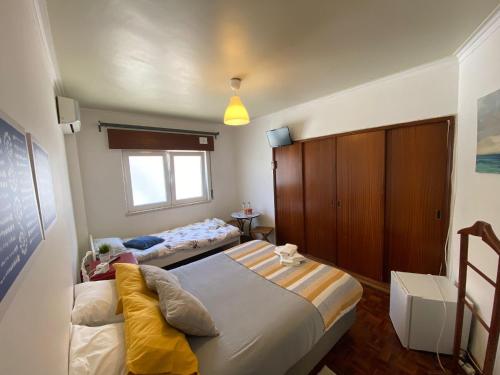 Postel nebo postele na pokoji v ubytování Guest House Patrocinio