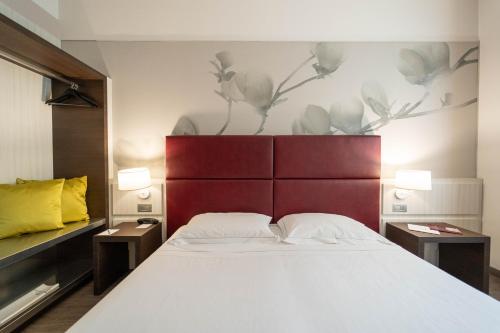 Cama o camas de una habitación en Hotel Villa Nabila