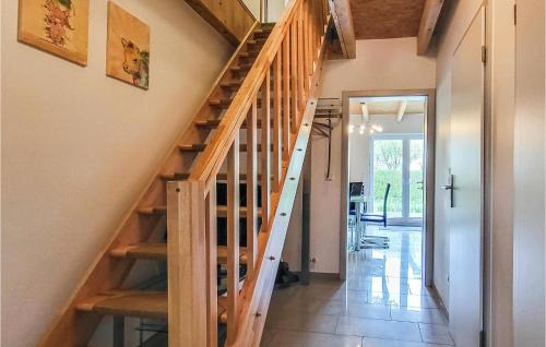 a wooden staircase in a house with a hallway at Lovely Home In Wittstock With Kitchen in Wittstock