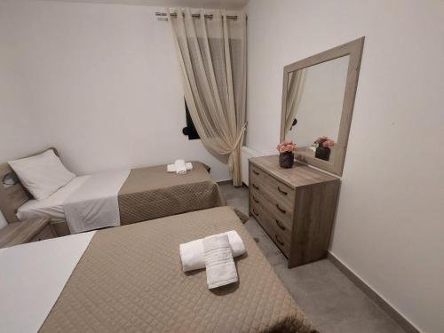 Ένα ή περισσότερα κρεβάτια σε δωμάτιο στο Irina's Apartment