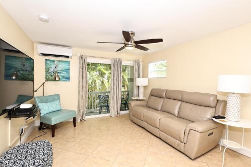 a living room with a couch and a chair at The Inn on Siesta Key in Siesta Key