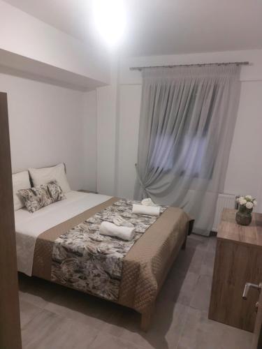 Ένα ή περισσότερα κρεβάτια σε δωμάτιο στο Irina's Apartment 2