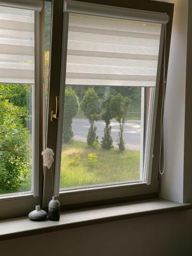 a window with a window shade in a room at Nidos Baltija in Nida