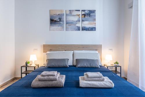 Ένα ή περισσότερα κρεβάτια σε δωμάτιο στο Santa Giulia Suite - 15min Duomo - Olympic Arena