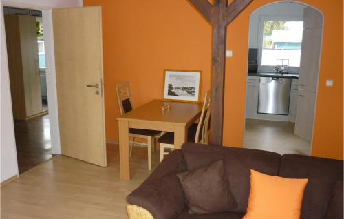 a living room with a couch and a table at Lovely Home In Heidesee Ot Wolzig in Heidesee