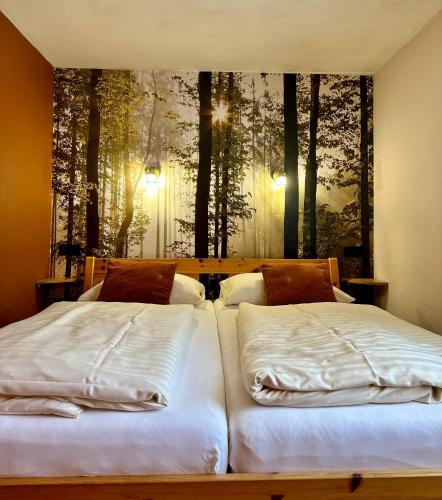 two beds sitting next to each other in a bedroom at Haus Wagner in Bad Kleinkirchheim