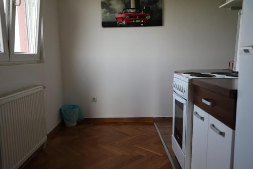 a kitchen with a stove and a white stove top oven at City Edge Belgrade in Belgrade