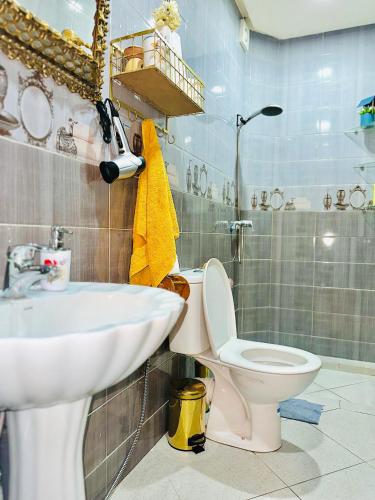 a bathroom with a toilet and a sink at Dar La Madina Essaouira in Essaouira