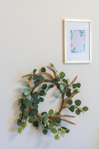 a wreath with a succulent plant on a wall at GRAND SUITE by F & G in Kastoria