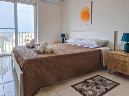 Ένα ή περισσότερα κρεβάτια σε δωμάτιο στο Island SeaView Oasis