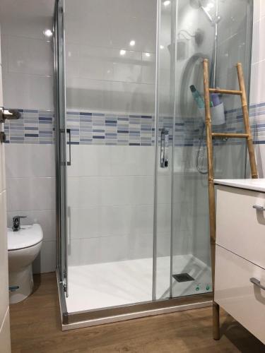 a shower with a glass door in a bathroom at Albir Adventino LOVE in Albir