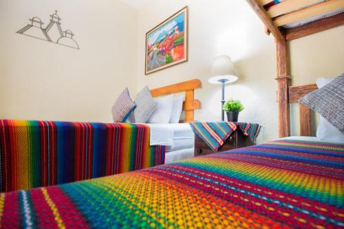 Ένα ή περισσότερα κρεβάτια σε δωμάτιο στο Hostal Antigua