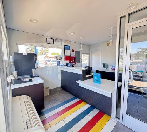 a store with a colorful rug in a room at Motel 6 Ontario, CA - Airport in Ontario