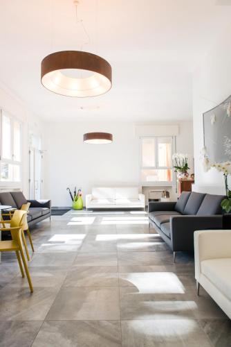 a living room with a couch and a table at Hotel Al Prato in Padova