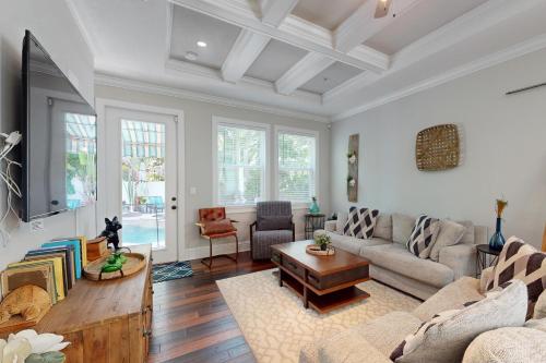 a living room with a couch and a table at Sunshine Palms in Tampa