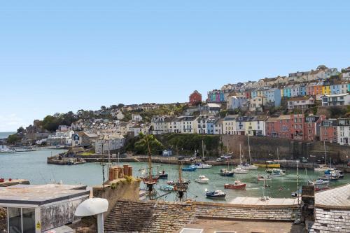 a group of boats in a harbor with buildings at Limpet Cottage - Beautiful Space & Close To Town in Brixham