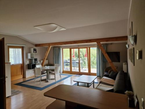 a living room with a couch and a table at Haus Astrid in Keutschach am See