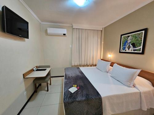 Postel nebo postele na pokoji v ubytování Cedro Hotel
