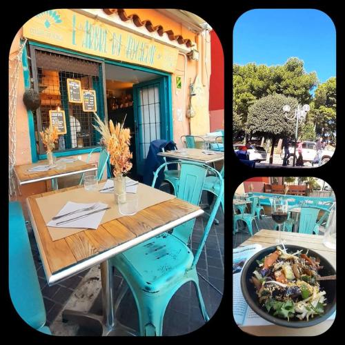 un restaurant avec une table et une assiette de nourriture dans l'établissement CHARME a 20 m de la plage centre village, à Collioure