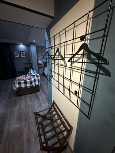 a room with a bed and a glass wall at Athina Airport Hotel in Thérmi