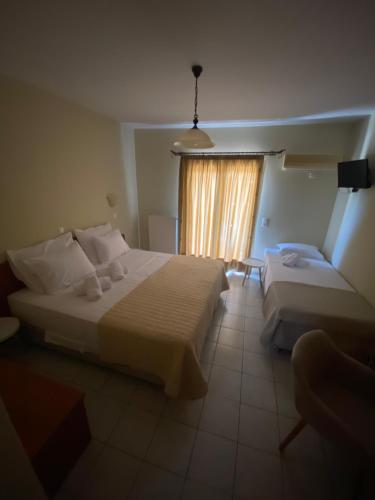Letto o letti in una camera di HOTEL ARIADNI