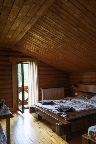 Postel nebo postele na pokoji v ubytování сottage "Ksenija" котедж "Ксенія"