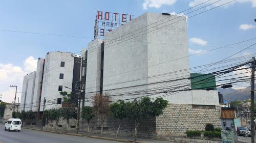 a white van parked in front of a building at Hotel Paraiso in Mexico City