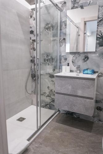 a bathroom with a shower and a sink at La Peonia B&B in Ragusa