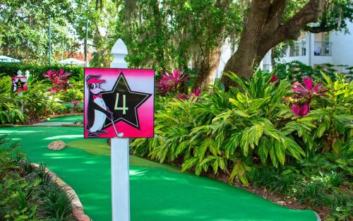 a sign with a cat on a green path at Star Island Resort and Club - Near Disney in Kissimmee