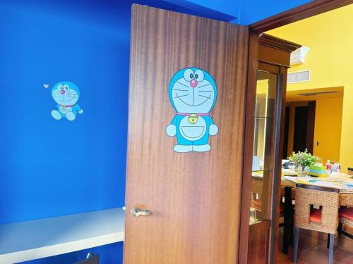 a door with a teddy bear sticker on it at 颯House5 in Osaka