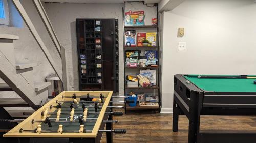a room with a pool table and a book shelf at Spacious&Gracious- 5BR Fam-Friendly near I95&Shops in Fairfield