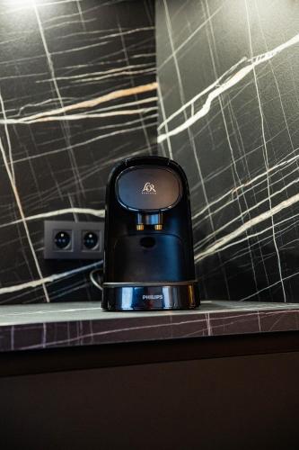 a cell phone sitting on top of a counter at La villa M in Sart-lez-Spa